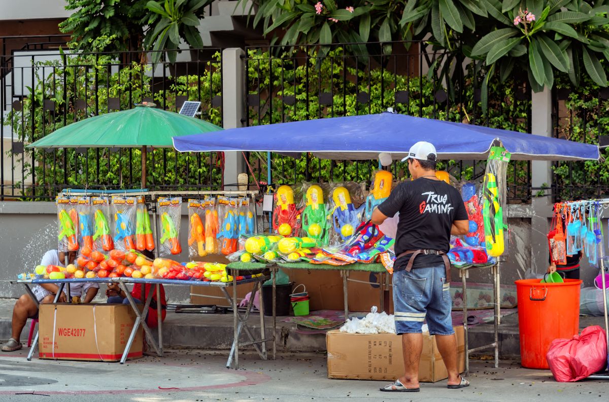 Pattaya before Songkran: street stalls stocked with water guns